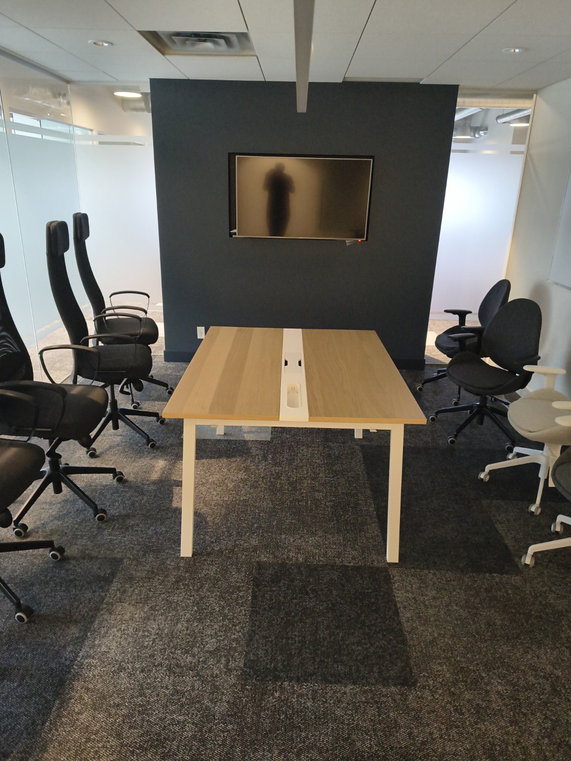 Completed office meeting table and assembled chairs